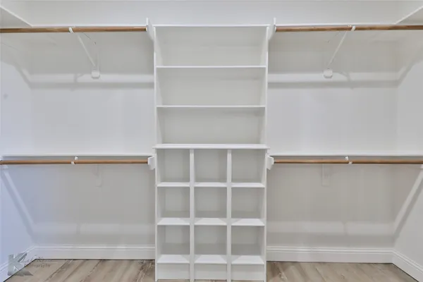 a view of an empty walk in closet