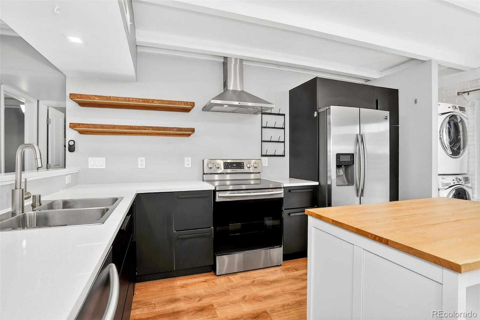 a kitchen with a sink a stove and refrigerator