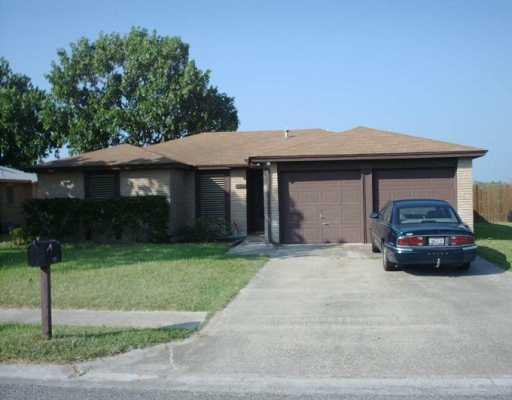 a car parked in front of white house