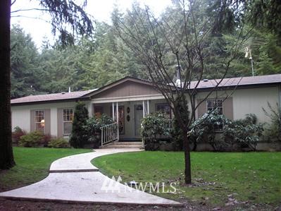 18233 Presley Lane Southwest Rochester, WA 98579 - Photo 1 of 1 a front view of a house with garden