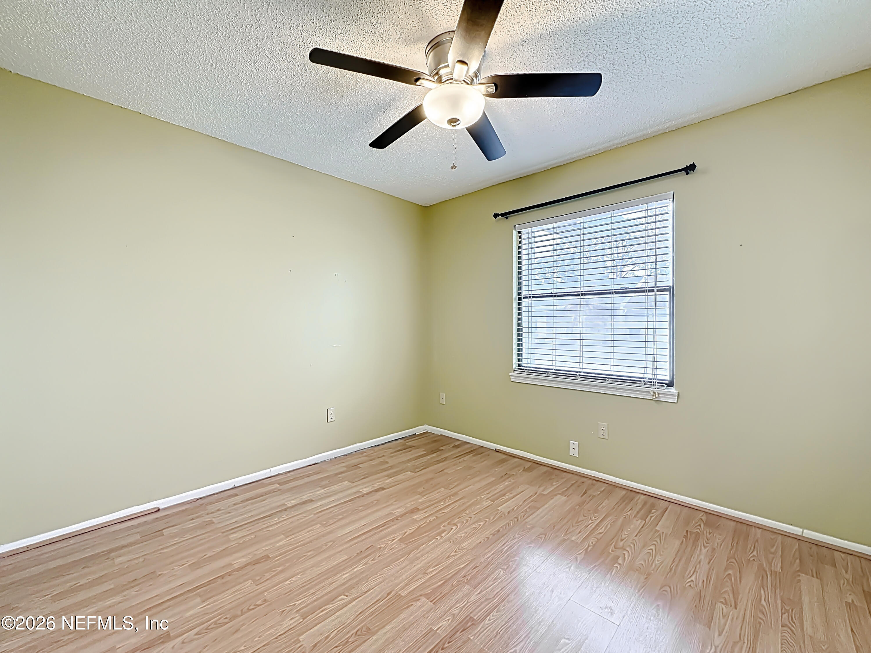 3410 Ricky Court Jacksonville, FL 32223 - Photo 15 of 37 an empty room with a window and a ceiling fan