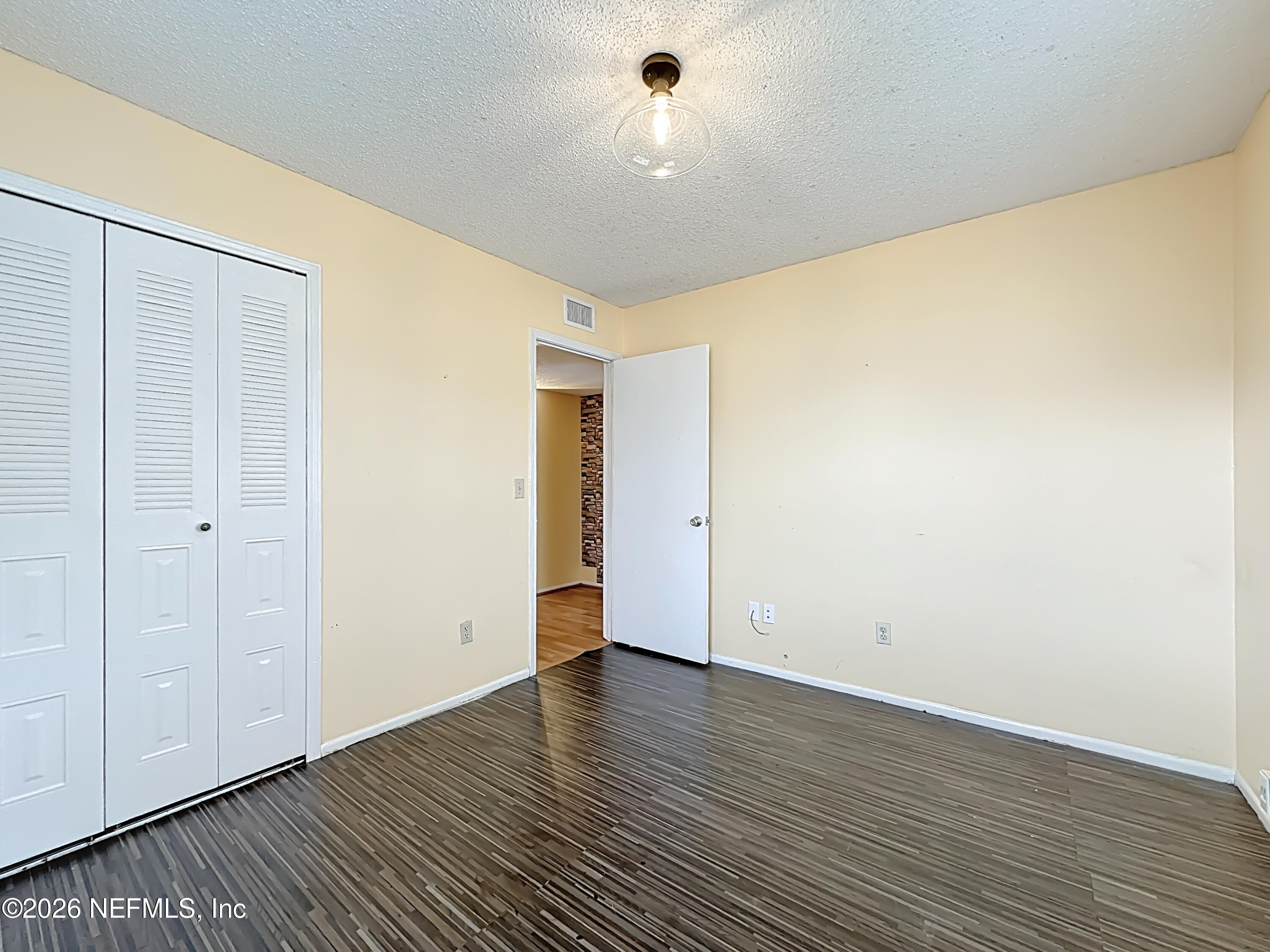 3410 Ricky Court Jacksonville, FL 32223 - Photo 20 of 37 a view of an empty room with wooden floor