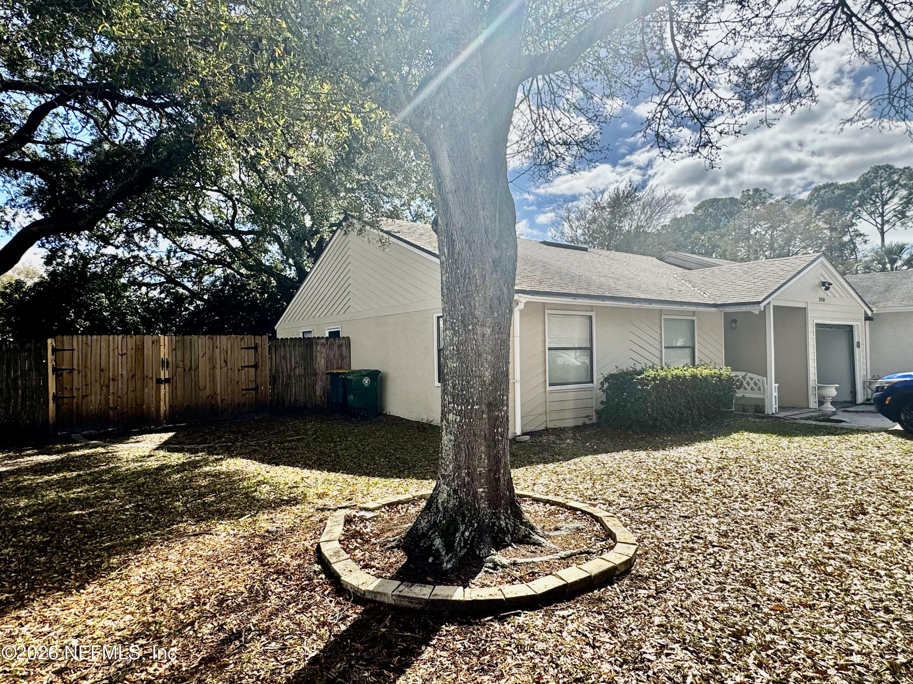 3410 Ricky Court Jacksonville, FL 32223 - Photo 3 of 37 a front view of a house with a yard