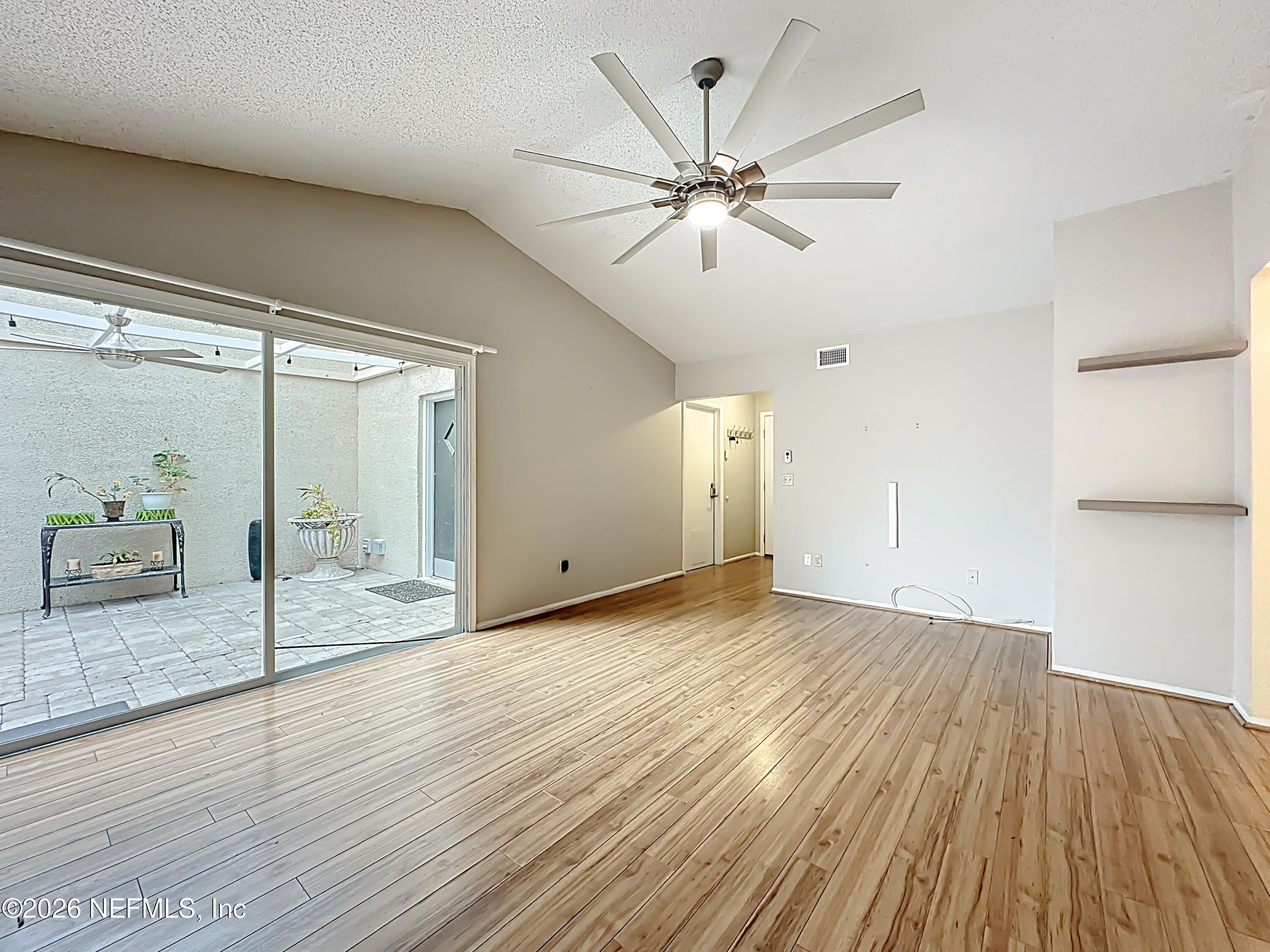 3410 Ricky Court Jacksonville, FL 32223 - Photo 6 of 37 a view of an empty room and wooden floor