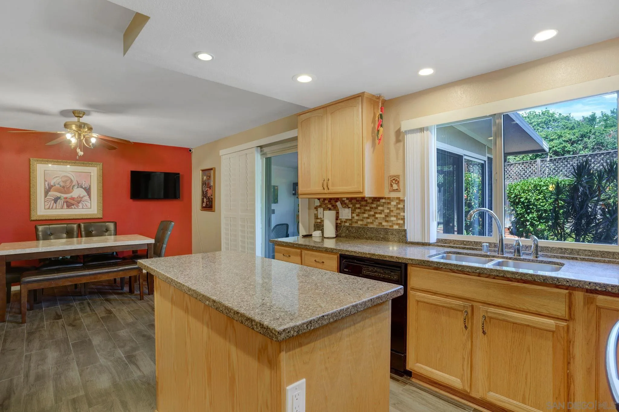 3006 Gayla Court Spring Valley, CA 91978 - Photo 11 of 39 a kitchen with stainless steel appliances granite countertop a sink and cabinets