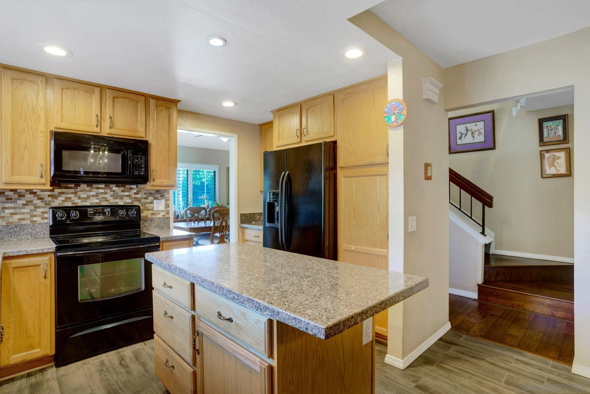 3006 Gayla Court Spring Valley, CA 91978 - Photo 13 of 39 a kitchen with stainless steel appliances a stove refrigerator and microwave