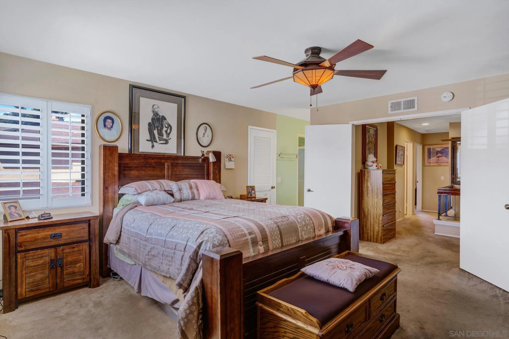 3006 Gayla Court Spring Valley, CA 91978 - Photo 22 of 39 a bedroom with a bed and a chandelier