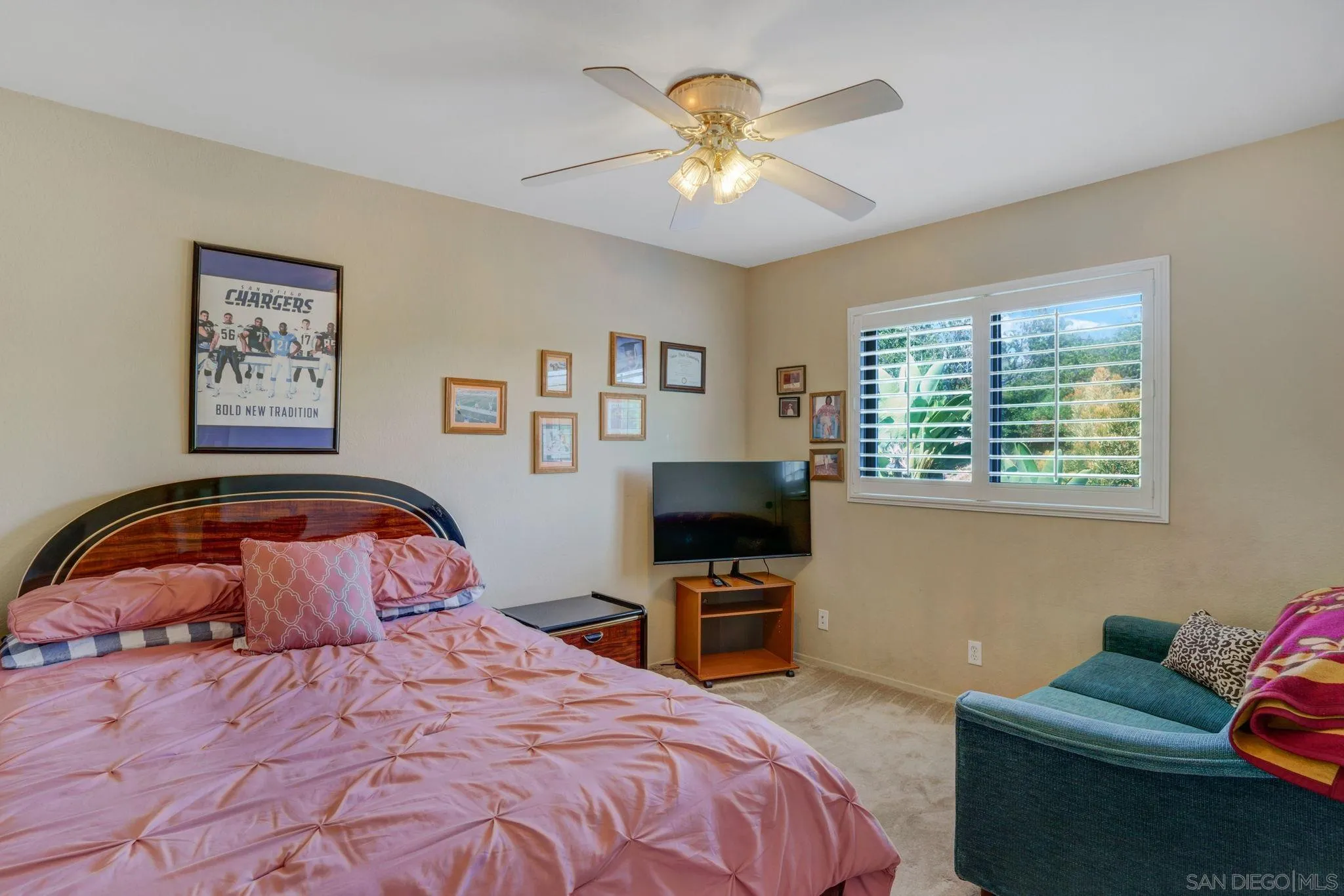 3006 Gayla Court Spring Valley, CA 91978 - Photo 24 of 39 a bedroom with a bed and a chandelier