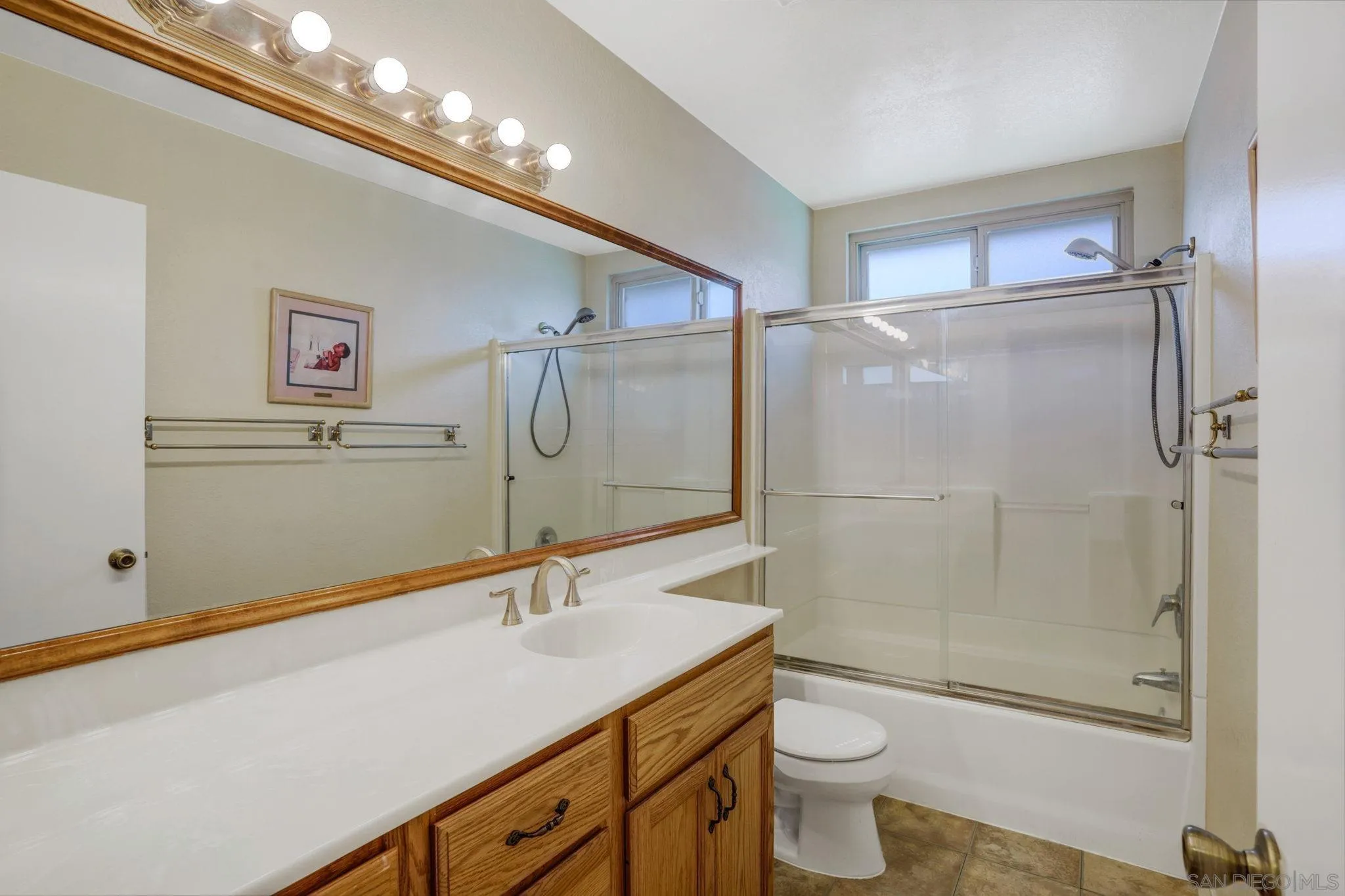 3006 Gayla Court Spring Valley, CA 91978 - Photo 26 of 39 a bathroom with a sink a toilet and shower