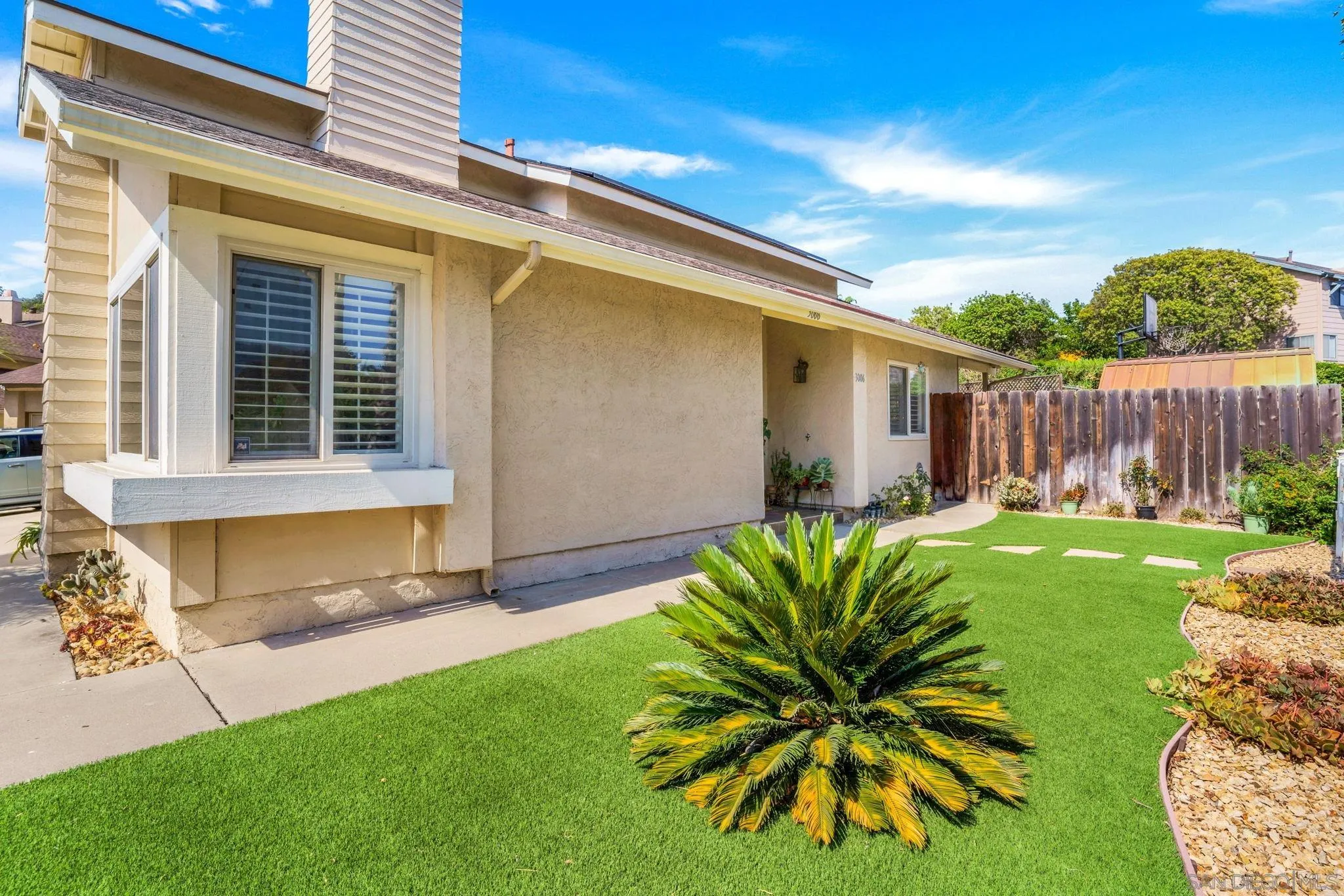 3006 Gayla Court Spring Valley, CA 91978 - Photo 3 of 39 a view of a backyard with couches plants and large tree