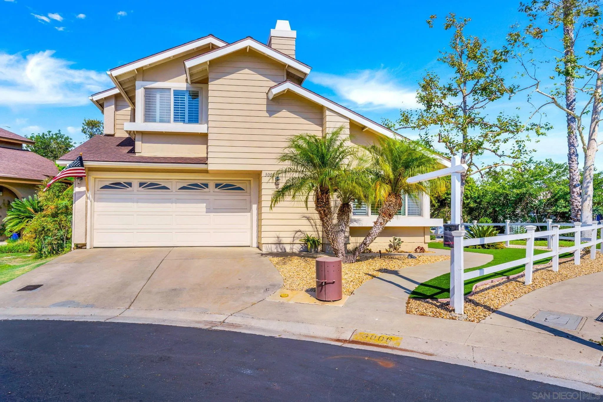 3006 Gayla Court Spring Valley, CA 91978 - Photo 38 of 39 a front view of a house with a yard and garage
