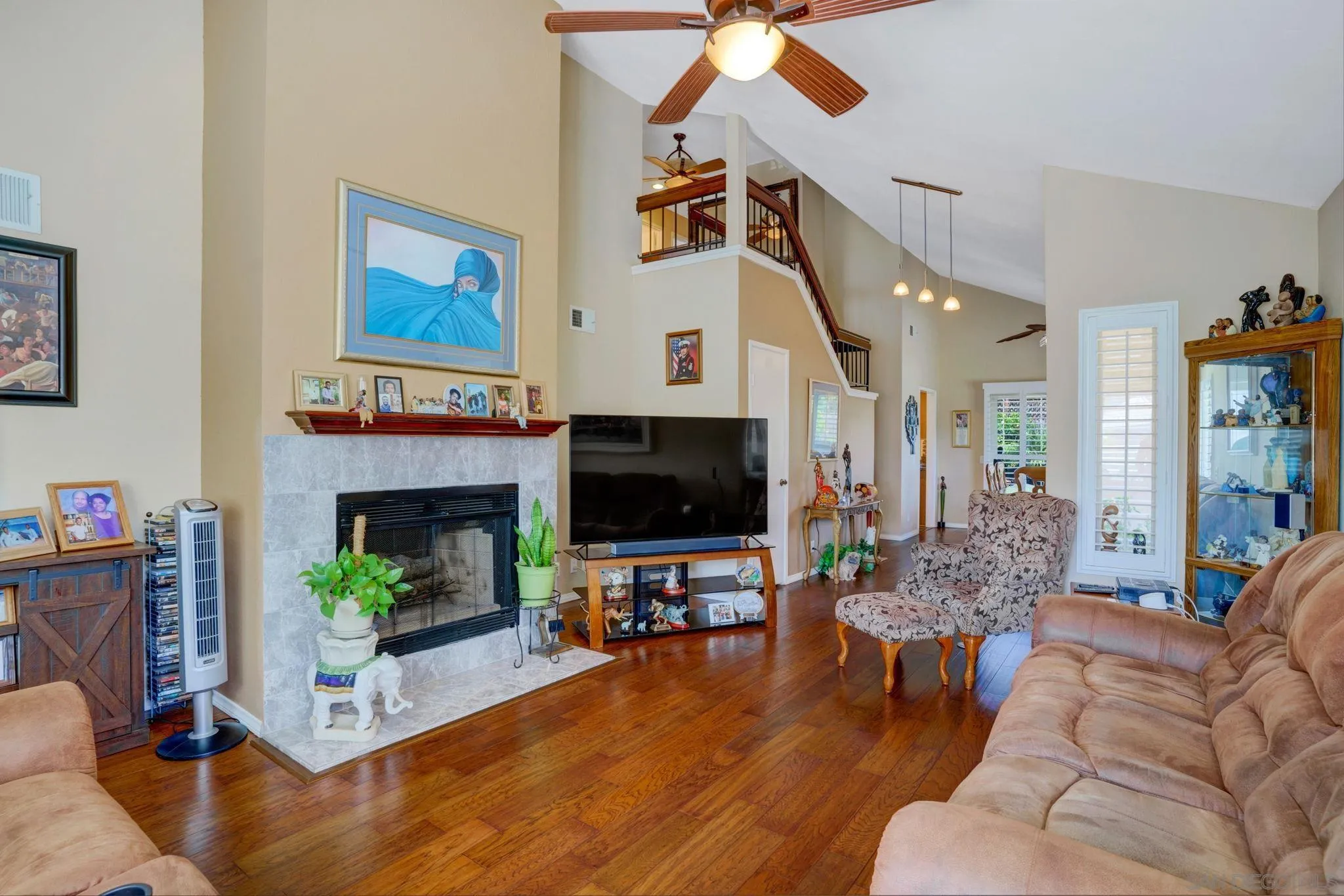 3006 Gayla Court Spring Valley, CA 91978 - Photo 5 of 39 a living room with furniture a fireplace and a flat screen tv