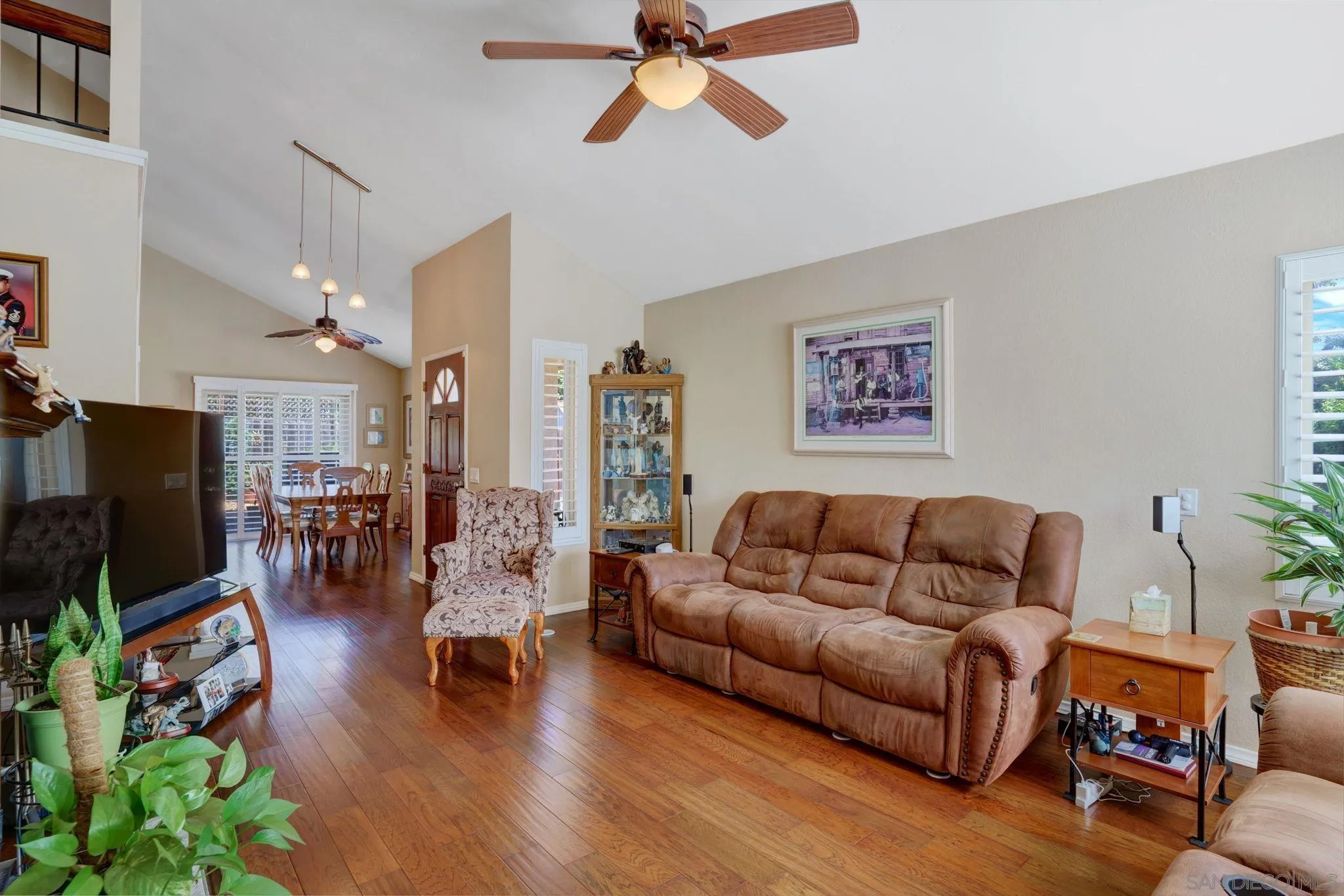 3006 Gayla Court Spring Valley, CA 91978 - Photo 7 of 39 a living room with furniture flat screen tv and wooden floor