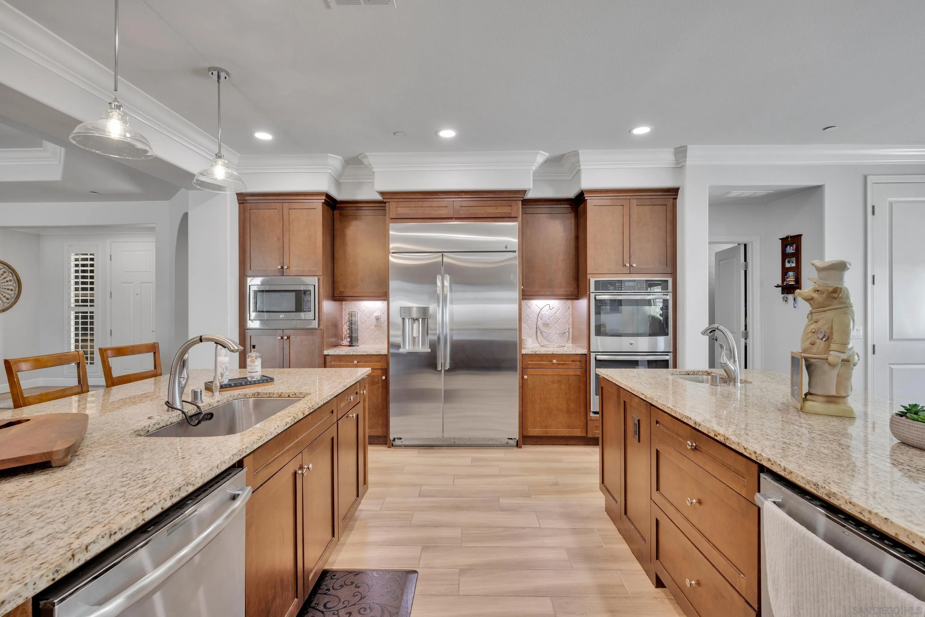 5620 Rancho Del Caballo Bonsall, CA 92003 - Photo 16 of 62 a kitchen with stainless steel appliances granite countertop a sink a stove and a refrigerator