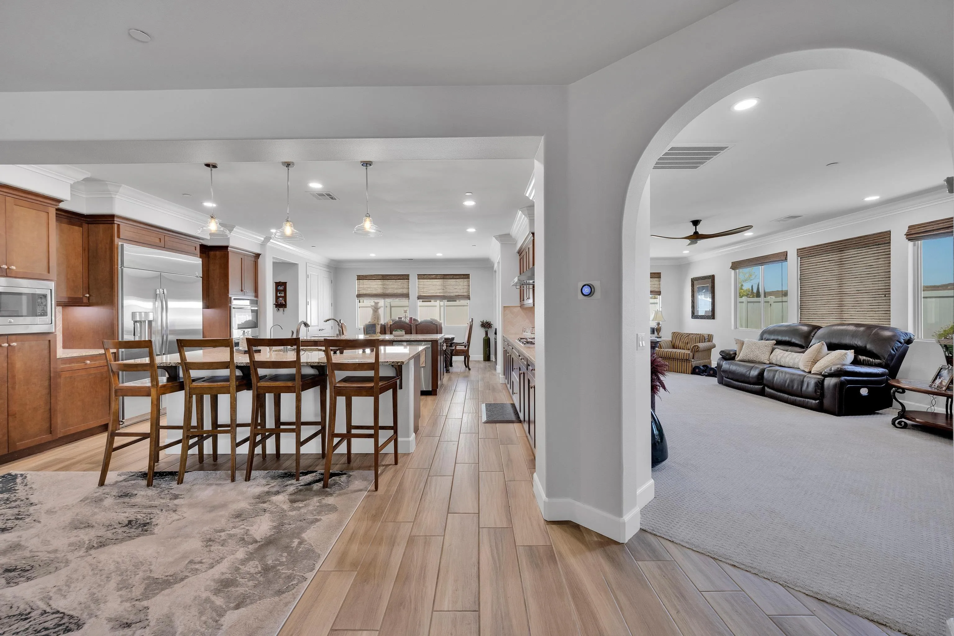 5620 Rancho Del Caballo Bonsall, CA 92003 - Photo 26 of 62 a view of a dining area with furniture and a kitchen
