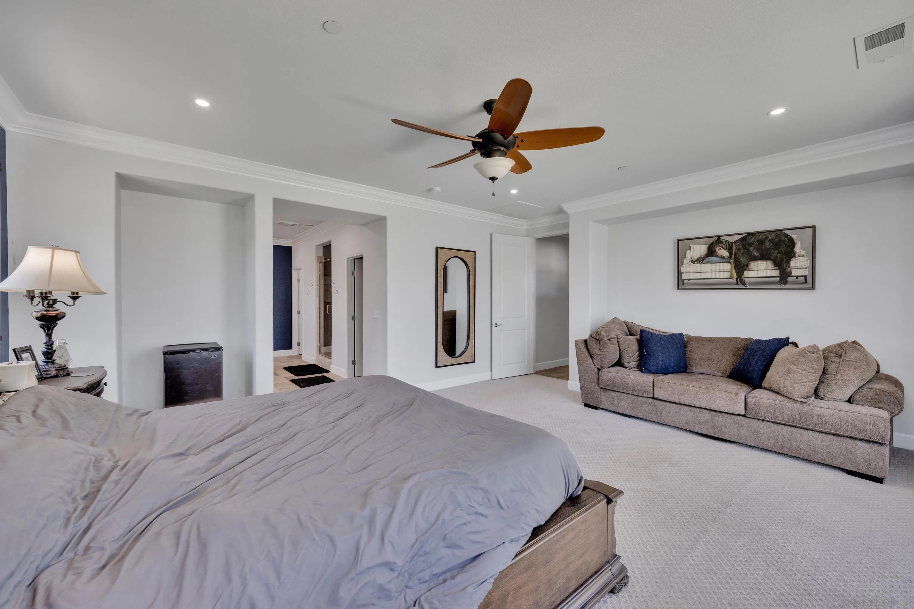 5620 Rancho Del Caballo Bonsall, CA 92003 - Photo 31 of 62 a spacious bedroom with a bed and ceiling fan