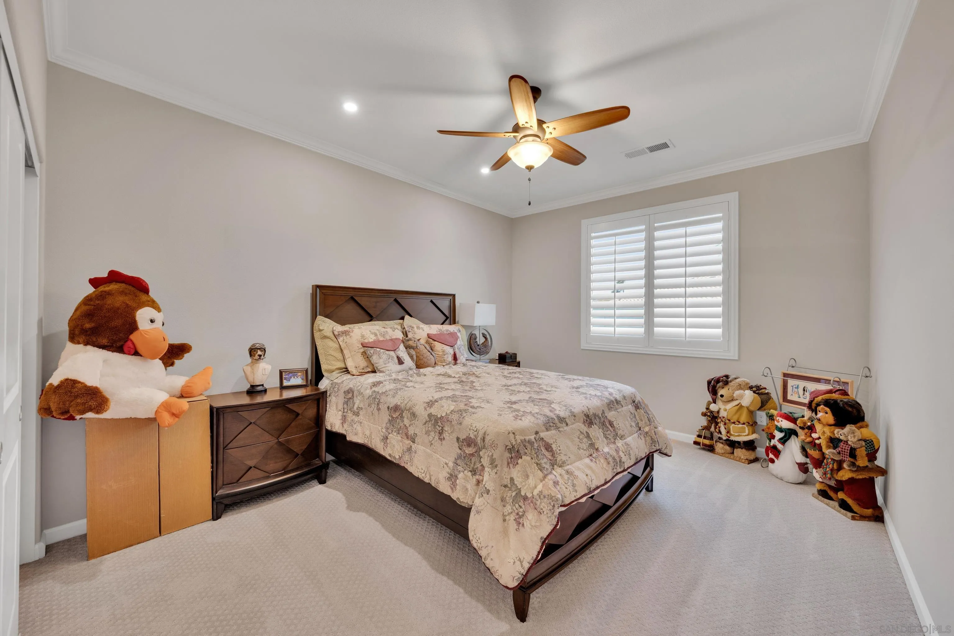 5620 Rancho Del Caballo Bonsall, CA 92003 - Photo 42 of 62 a bedroom with a bed and a chandelier