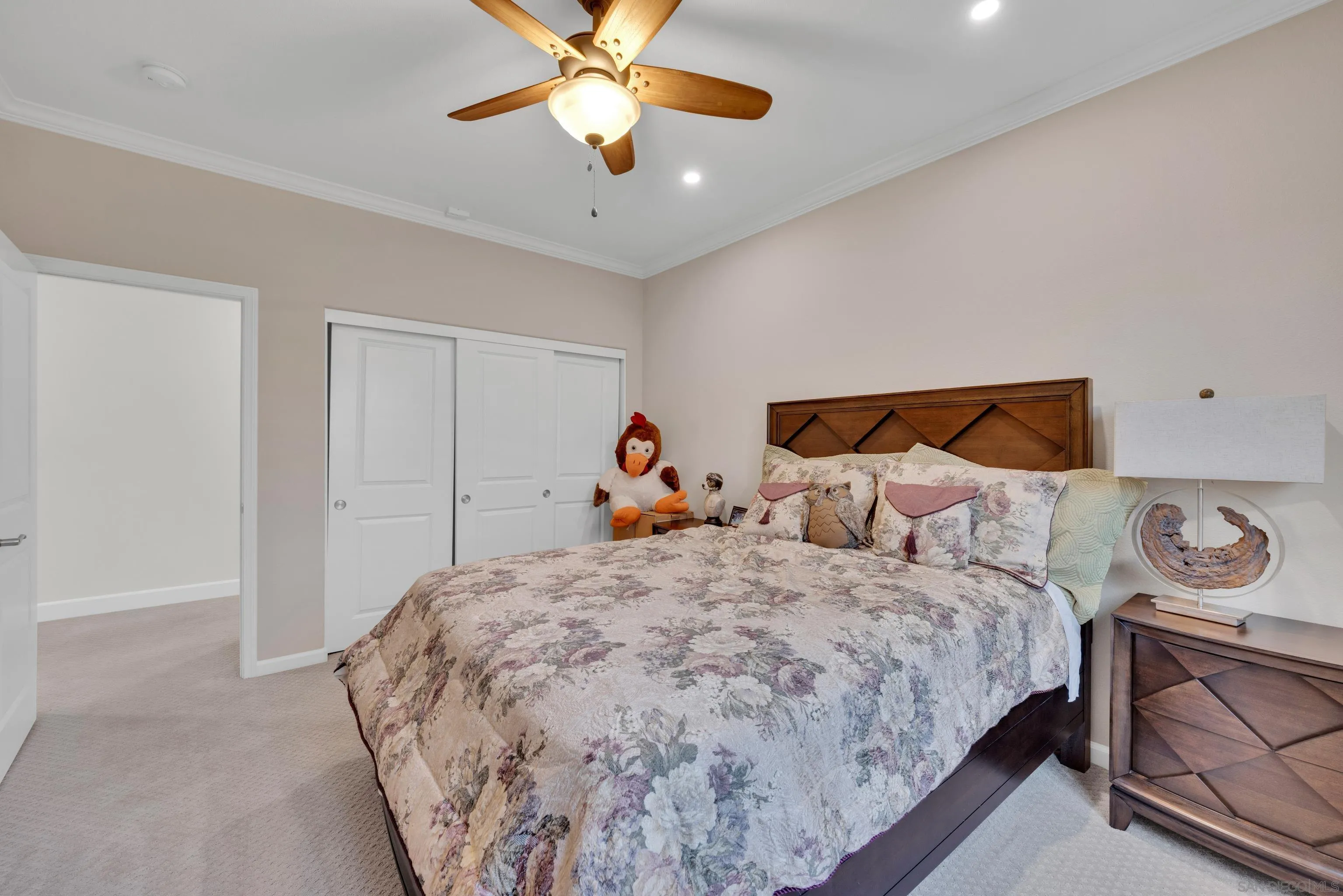 5620 Rancho Del Caballo Bonsall, CA 92003 - Photo 43 of 62 a bedroom with a bed and a chandelier