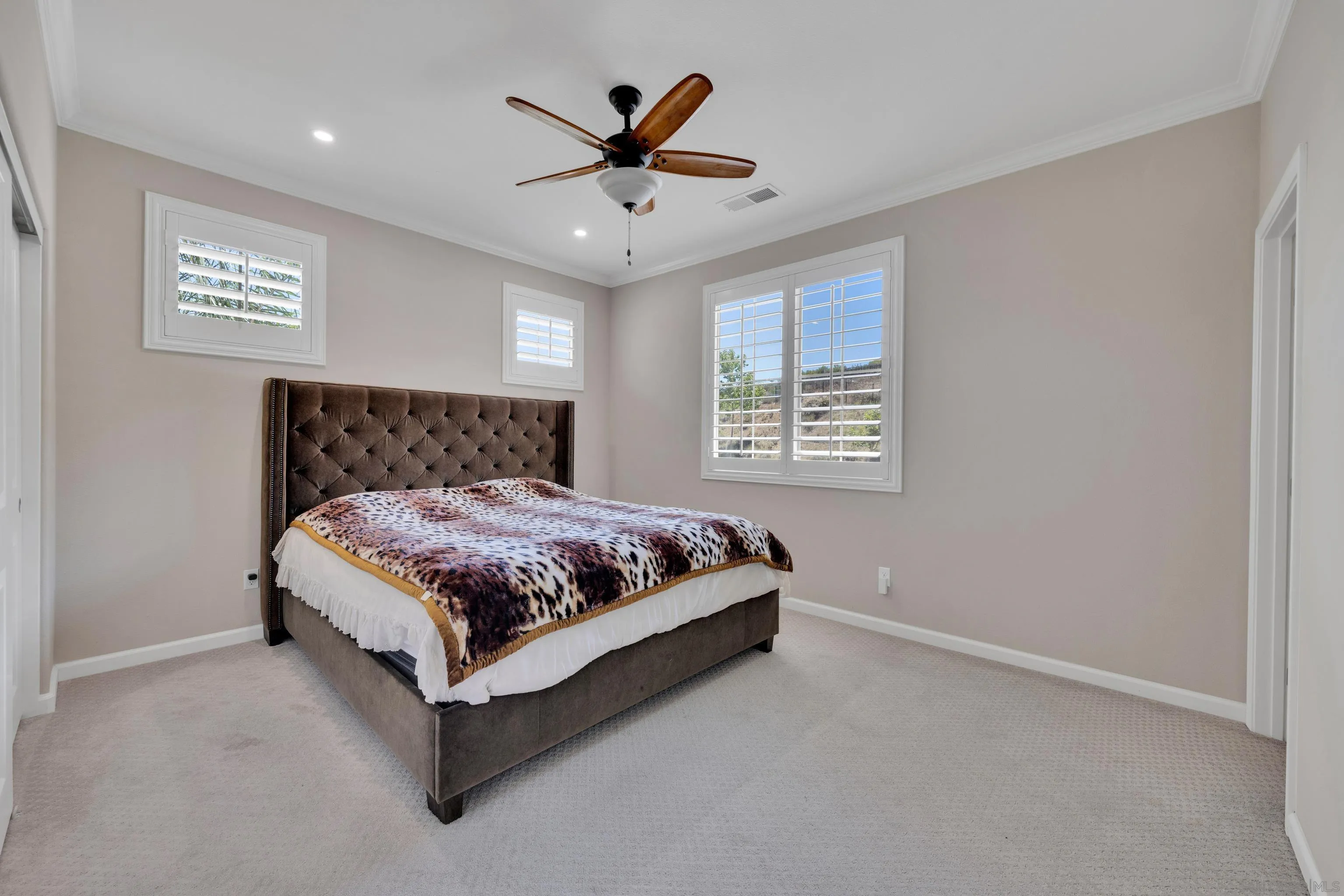 5620 Rancho Del Caballo Bonsall, CA 92003 - Photo 44 of 62 a bed sitting in a room next to a window