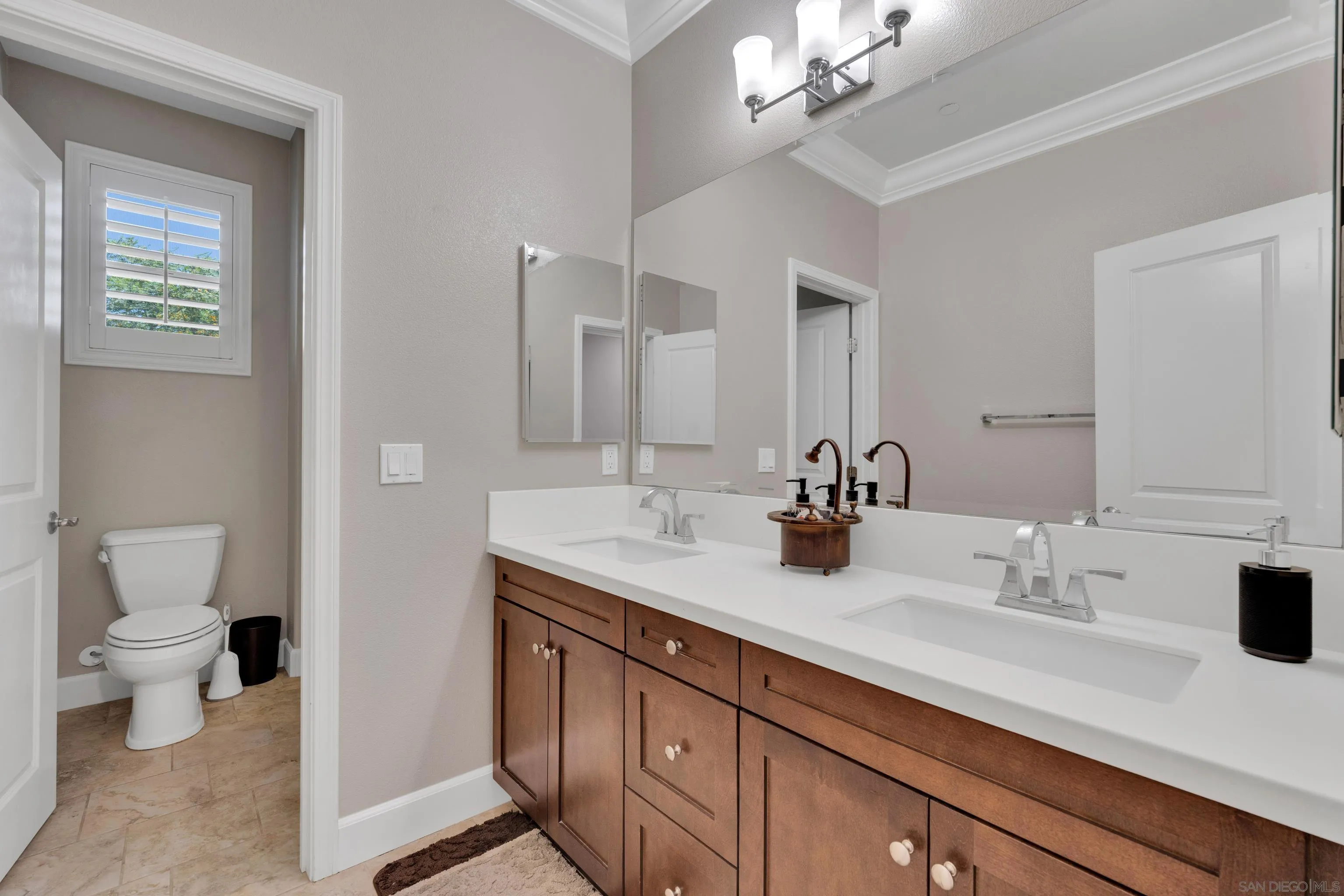 5620 Rancho Del Caballo Bonsall, CA 92003 - Photo 48 of 62 a bathroom with a sink a toilet and a mirror
