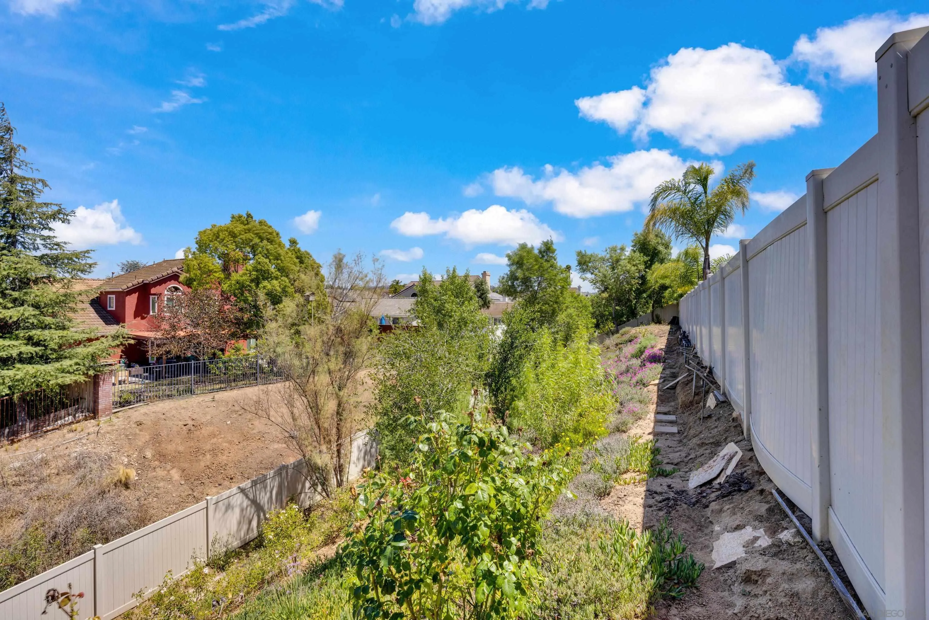 5620 Rancho Del Caballo Bonsall, CA 92003 - Photo 57 of 62 a view of a yard with flower plants