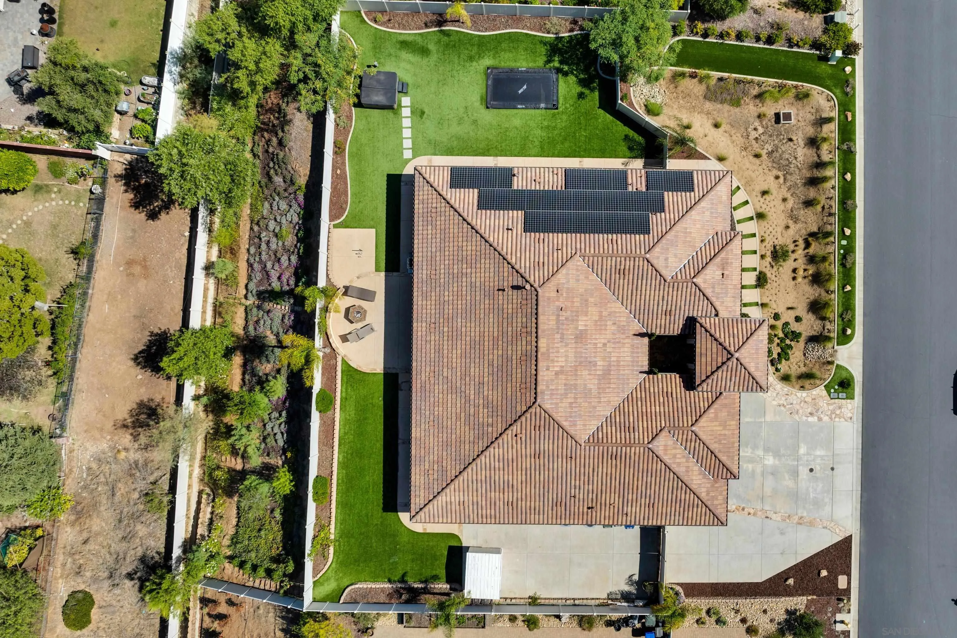 5620 Rancho Del Caballo Bonsall, CA 92003 - Photo 60 of 62 an aerial view of a house with a yard and large trees