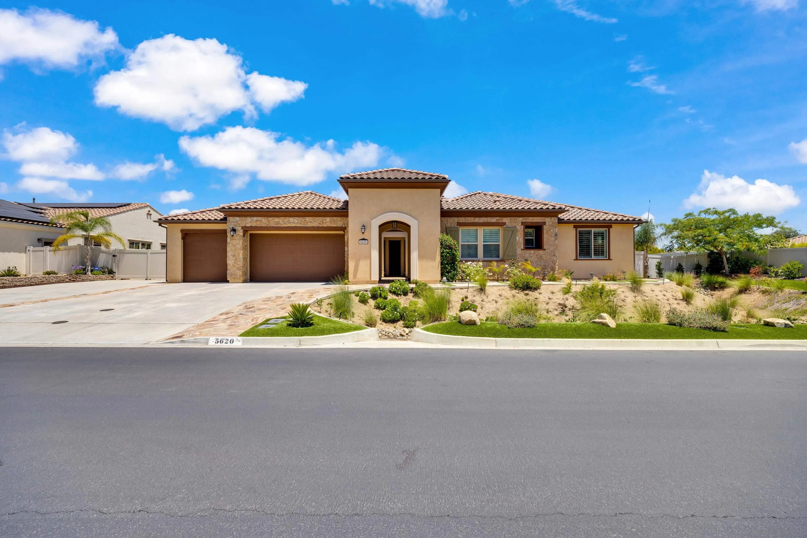 5620 Rancho Del Caballo Bonsall, CA 92003 - Photo 6 of 62 a front view of a house with a yard
