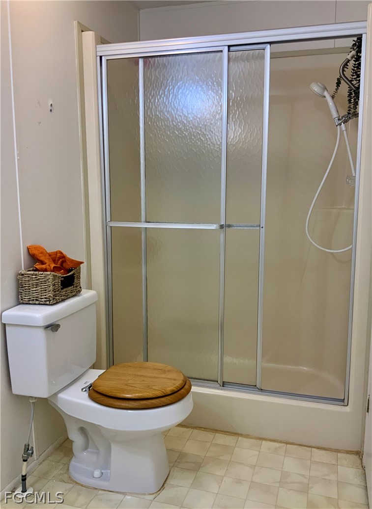 15550 Burnt Store Road, Unit 89 Punta Gorda, FL 33955 - Photo 11 of 28 a bathroom with a toilet and a shower
