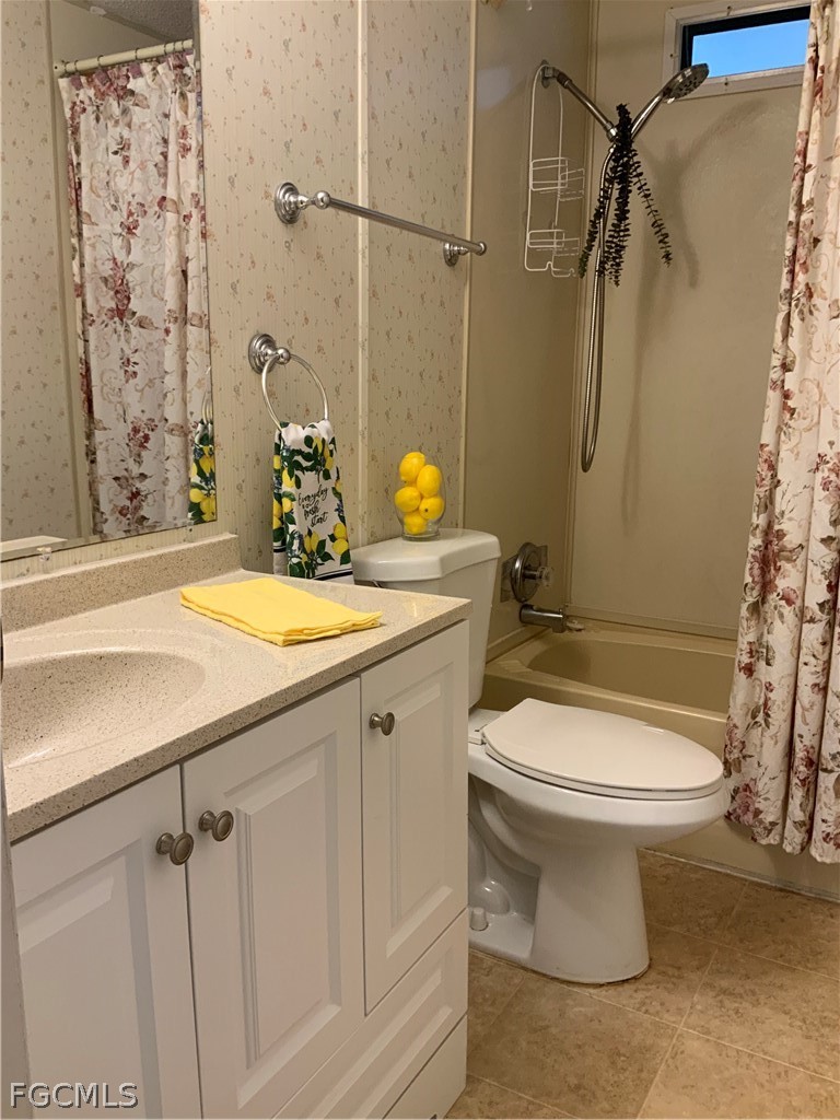 15550 Burnt Store Road, Unit 89 Punta Gorda, FL 33955 - Photo 13 of 28 a bathroom with a sink toilet and shower