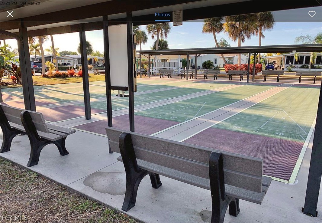 15550 Burnt Store Road, Unit 89 Punta Gorda, FL 33955 - Photo 19 of 28 a view of a patio with a table chairs and a table