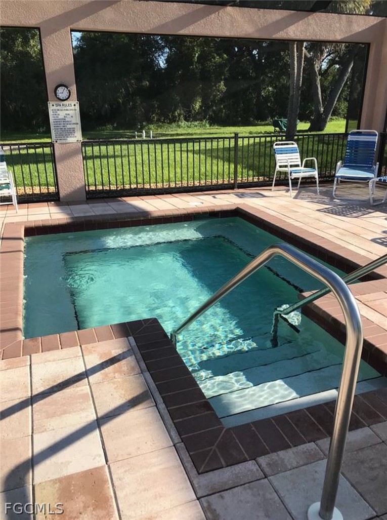 15550 Burnt Store Road, Unit 89 Punta Gorda, FL 33955 - Photo 21 of 28 a view of a chairs and table on the patio