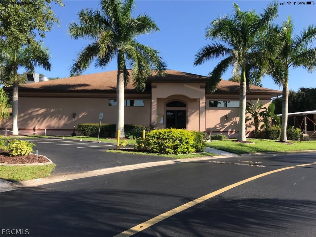 15550 Burnt Store Road, Unit 89 Punta Gorda, FL 33955 - Photo 26 of 28 a front view of a house with garden