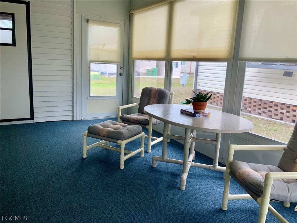 15550 Burnt Store Road, Unit 89 Punta Gorda, FL 33955 - Photo 28 of 28 a dining room with furniture and windows
