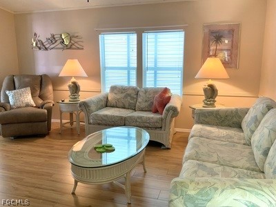 15550 Burnt Store Road, Unit 89 Punta Gorda, FL 33955 - Photo 7 of 28 a living room with furniture and a large window