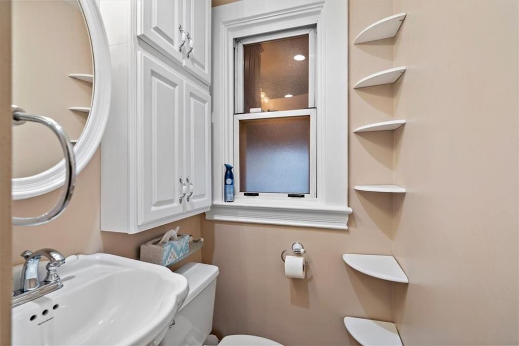 1140 Race Street McKees Rocks, PA 15136 - Photo 17 of 25 a bathroom with a sink a toilet and mirror