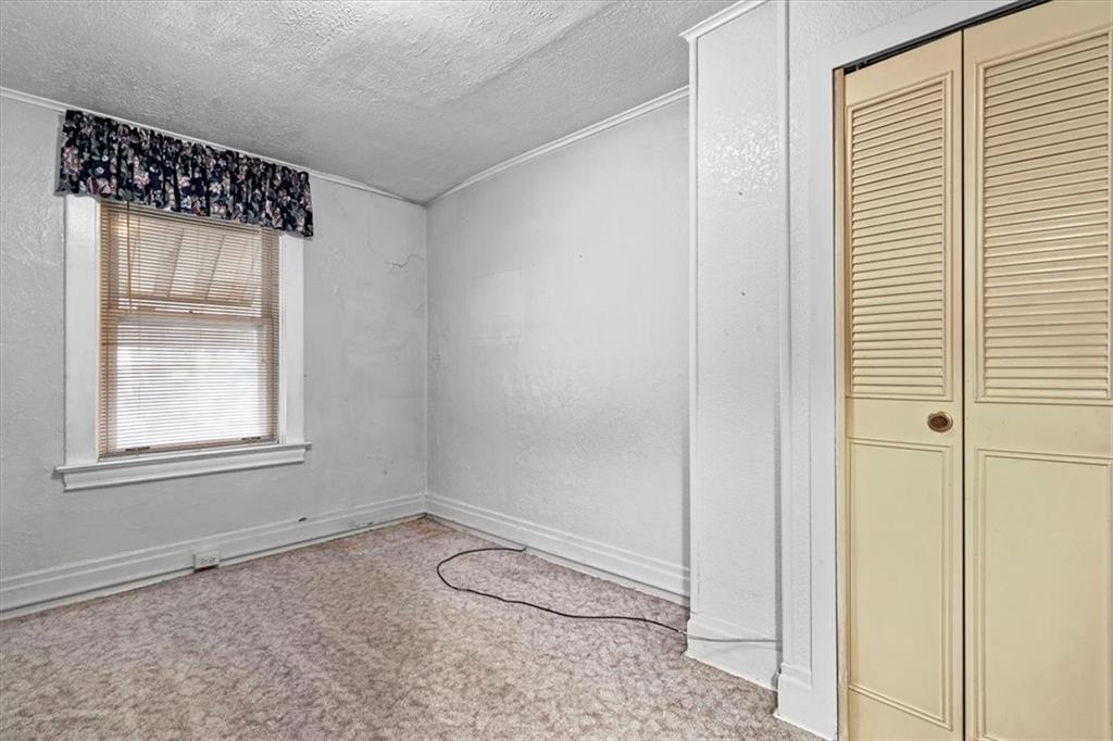 1140 Race Street McKees Rocks, PA 15136 - Photo 18 of 25 an empty room with a window