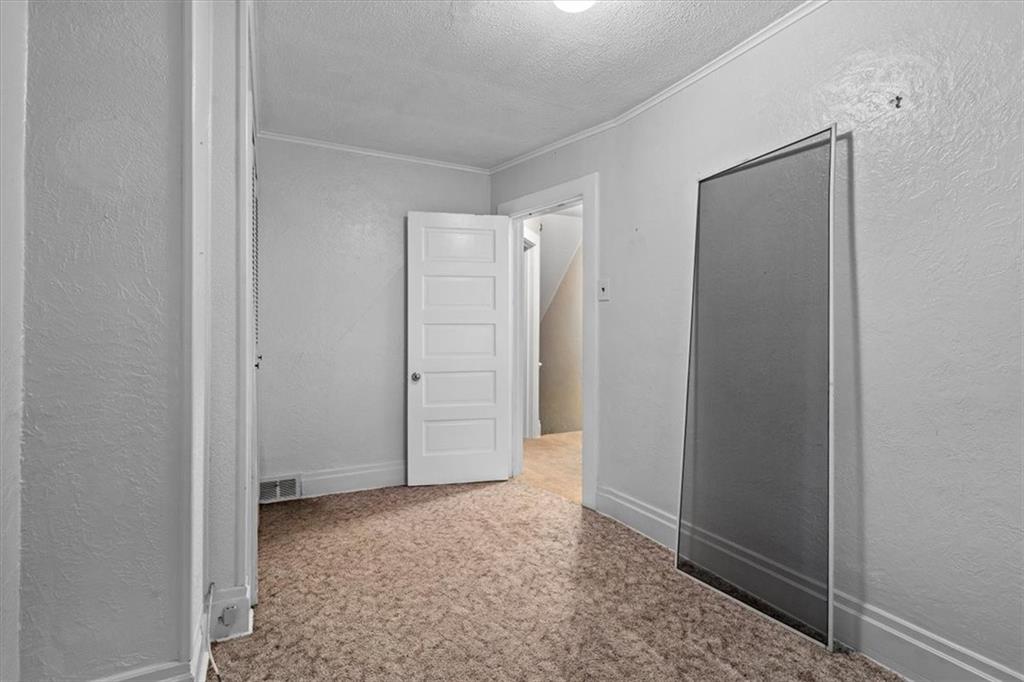 1140 Race Street McKees Rocks, PA 15136 - Photo 19 of 25 an empty room with closet