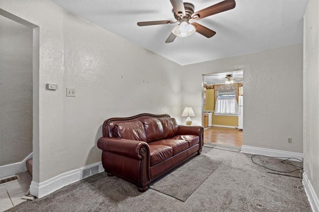 1140 Race Street McKees Rocks, PA 15136 - Photo 6 of 25 a living room with furniture and a ceiling fan