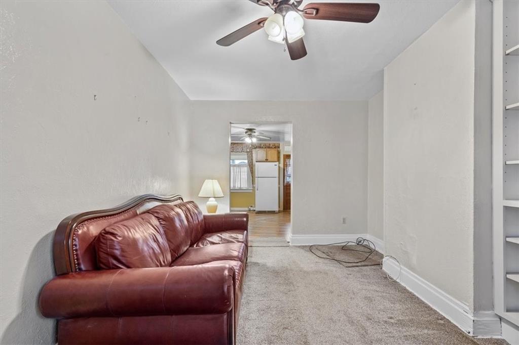 1140 Race Street McKees Rocks, PA 15136 - Photo 7 of 25 a living room with furniture and a ceiling fan
