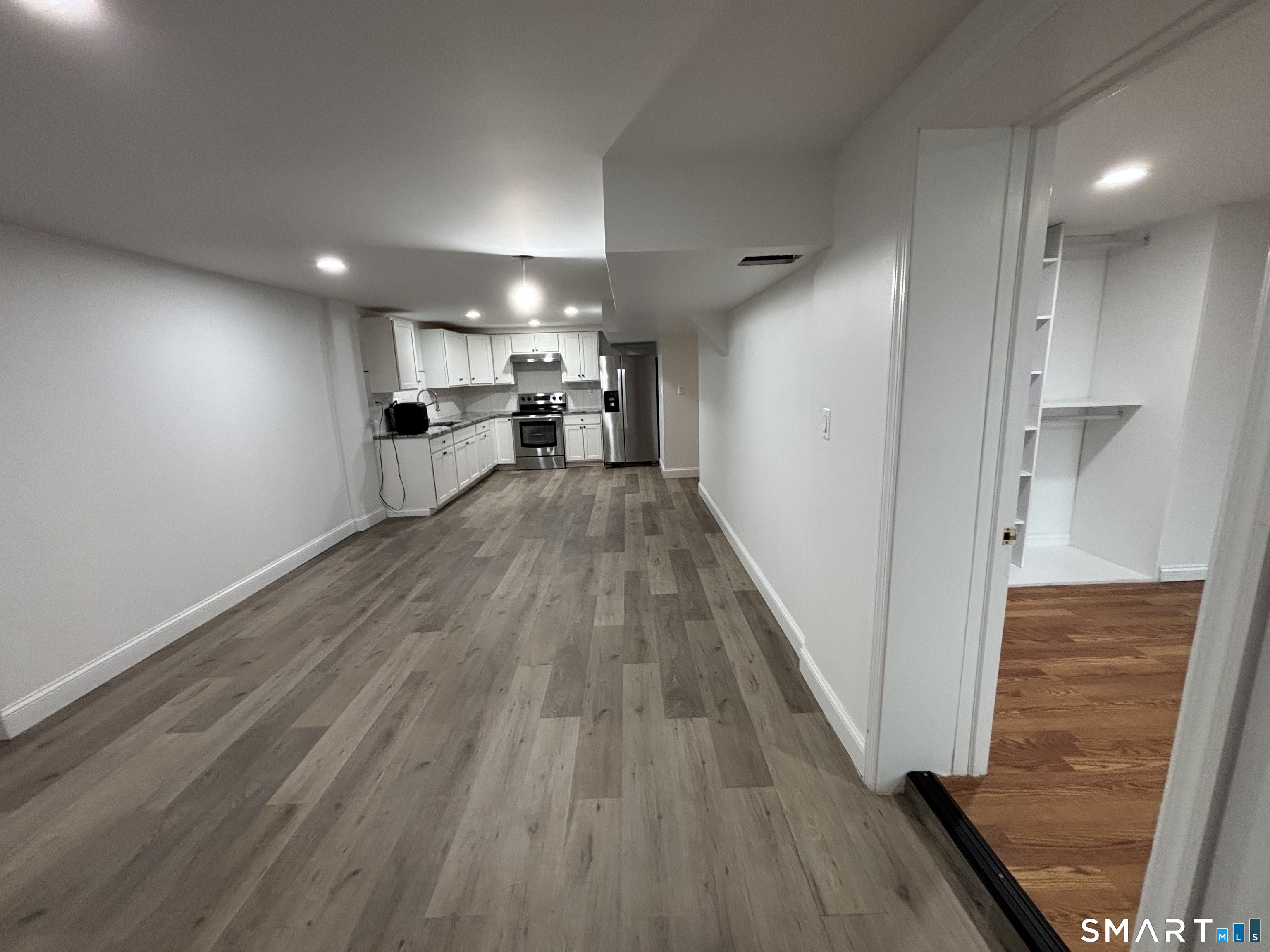 76 Cannon Street Hamden, CT 06518 - Photo 2 of 9 a view of a kitchen with wooden floor