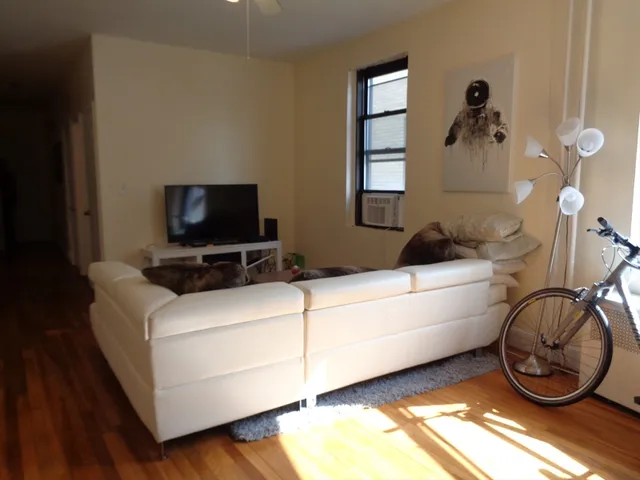 a living room with a couch and a flat screen tv