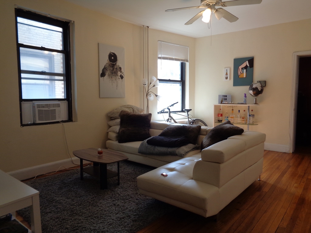 40 Carlton Street, Unit 5 Brookline, MA 02446 - Photo 6 of 6 a living room with furniture and a window
