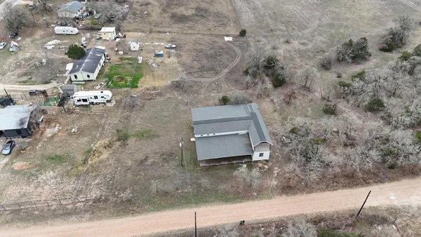 an aerial view of residential house with outdoor space