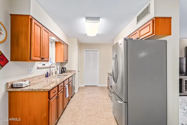 a bathroom with a sink a mirror and a shower