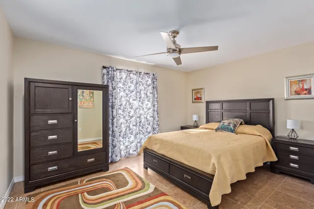 a bedroom with a bed and a dresser