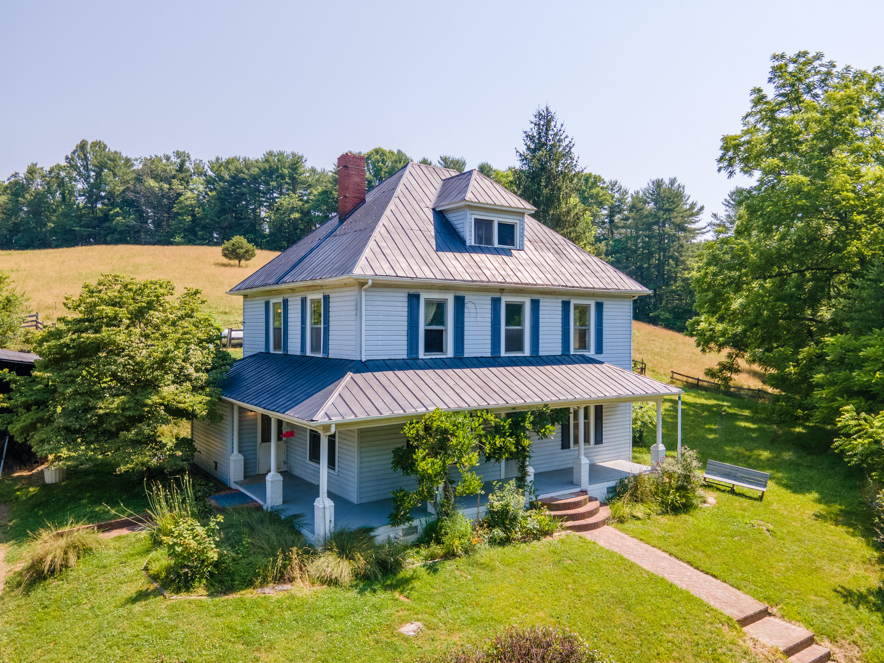 415 Reed Hill Road Northwest Floyd, VA 24091 - Photo 1 of 69 a aerial view of a house with yard porch and sitting area