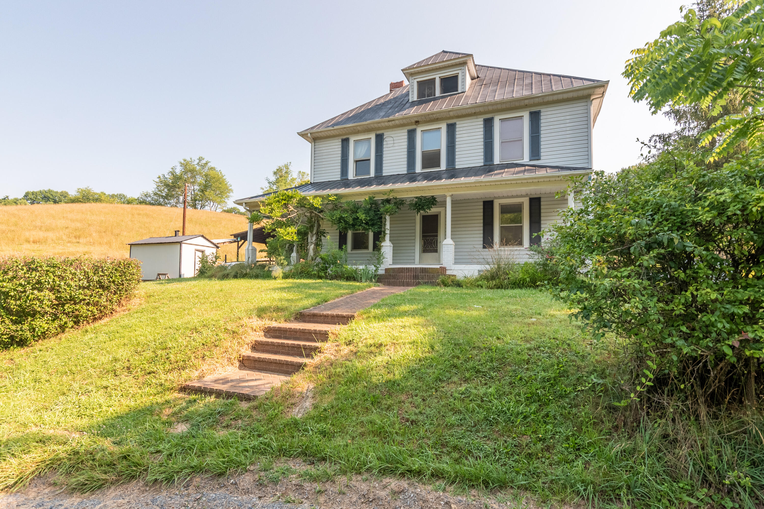 415 Reed Hill Road Northwest Floyd, VA 24091 - Photo 13 of 69 a front view of a house with a yard