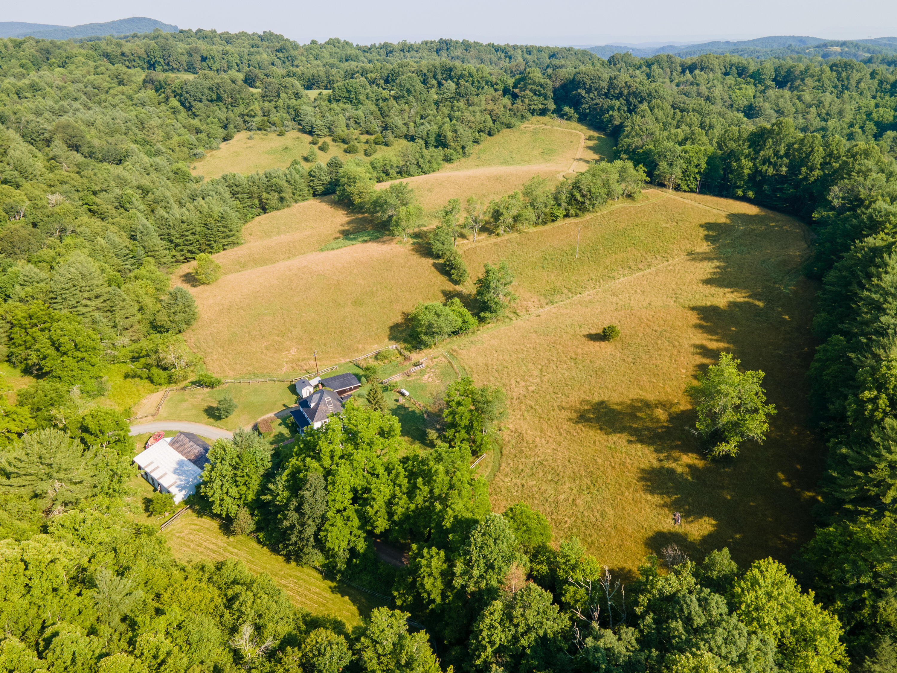 415 Reed Hill Road Northwest Floyd, VA 24091 - Photo 3 of 69 a view of a lake with a yard