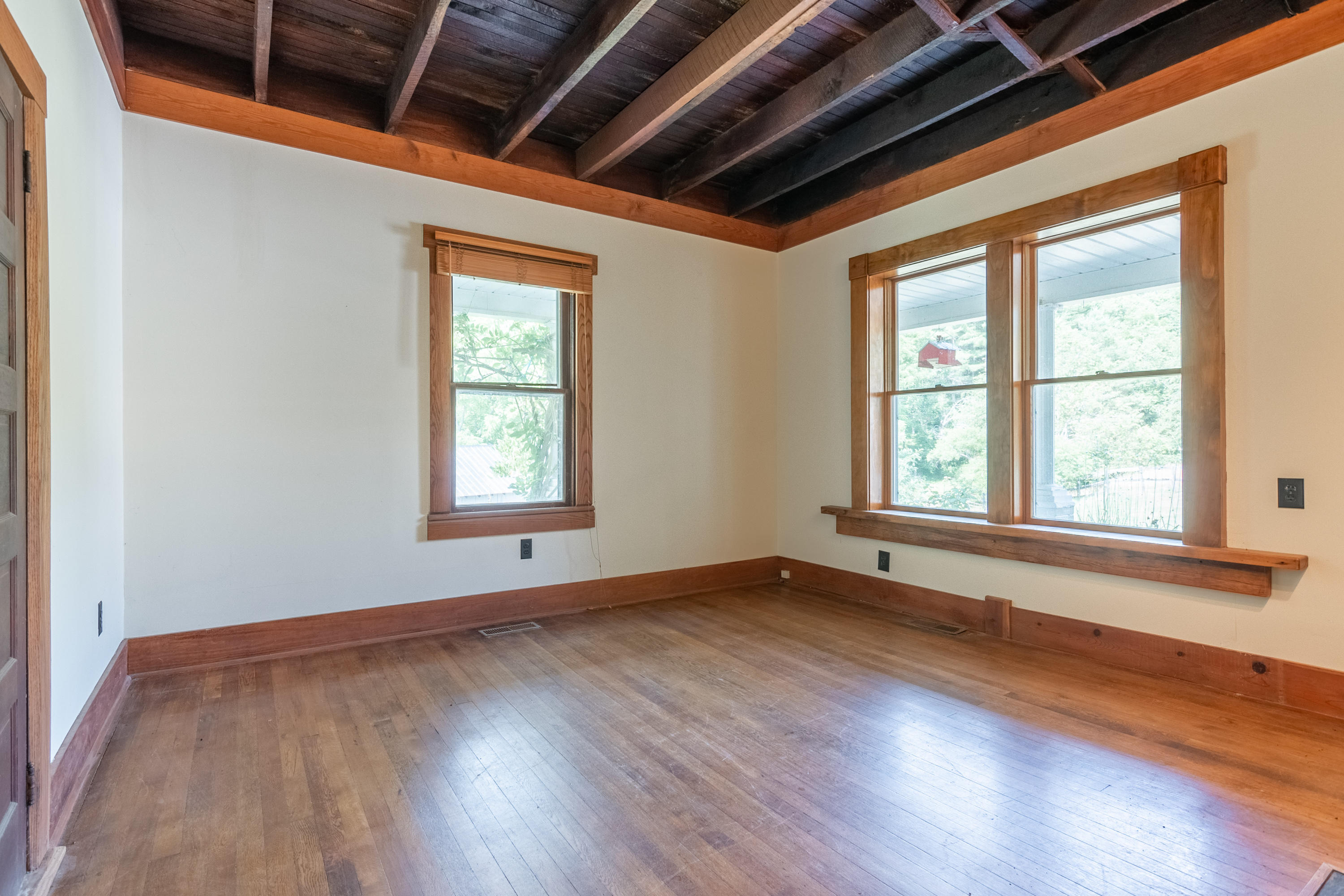 415 Reed Hill Road Northwest Floyd, VA 24091 - Photo 21 of 69 an empty room with wooden floor and windows