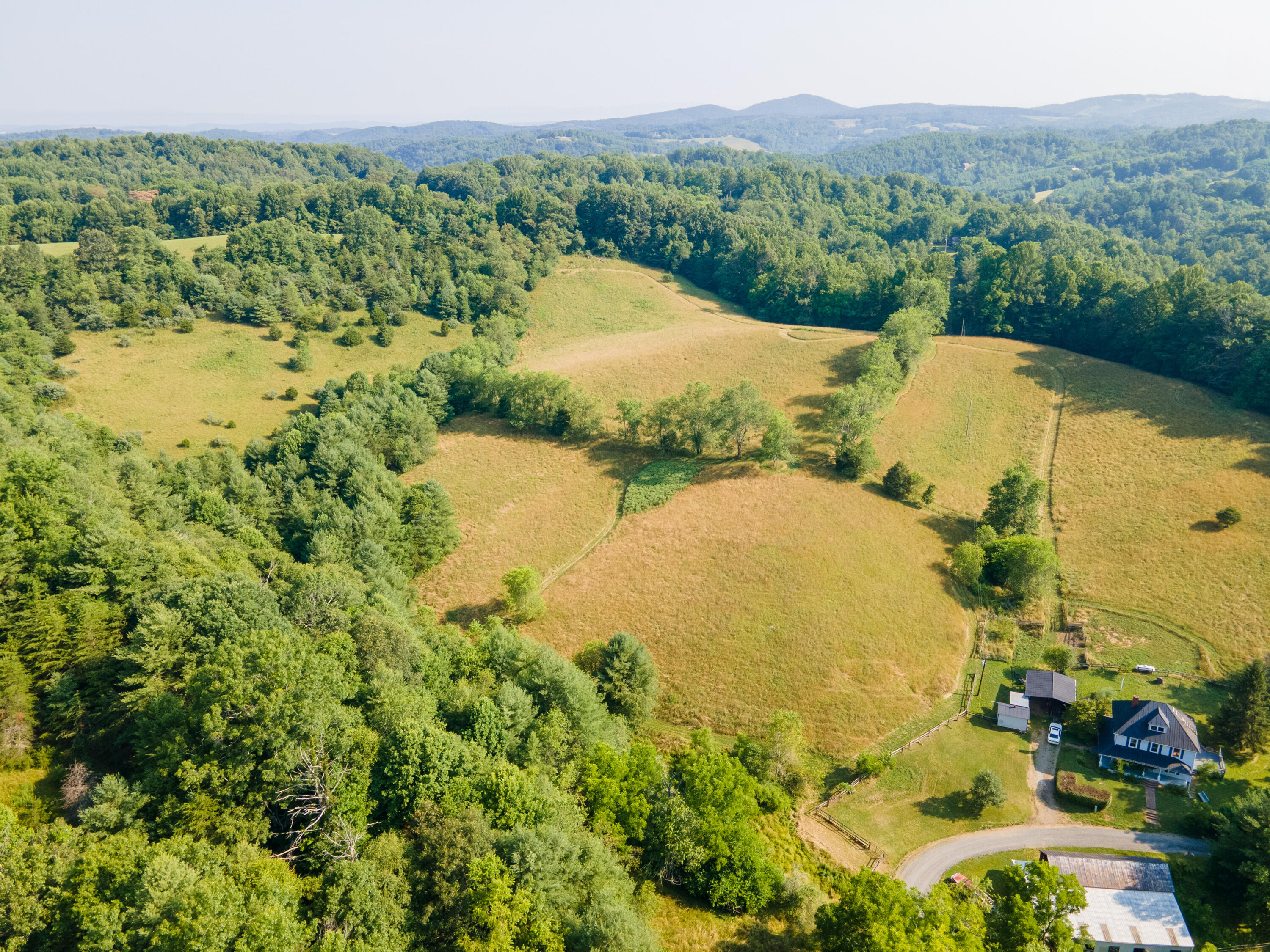415 Reed Hill Road Northwest Floyd, VA 24091 - Photo 5 of 69 a view of a lake with a yard
